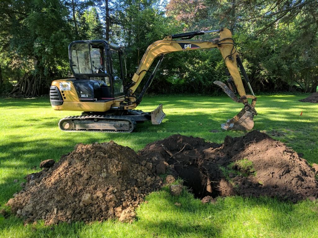 Mini-excavator working at a residential site