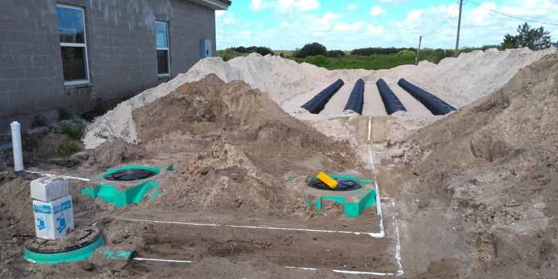 Septic system installation in progress at a new residential build